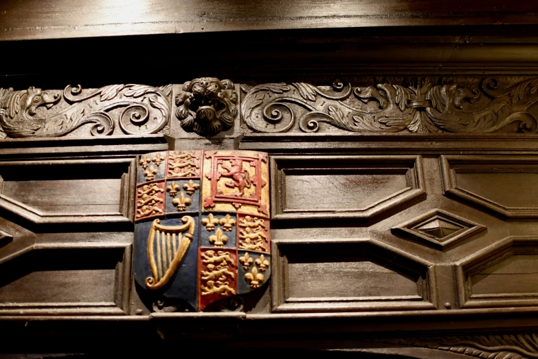 a decorative item mounted on the wall of an old building