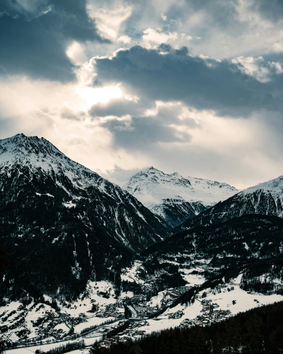 mountains under a cloudy sky in the winter