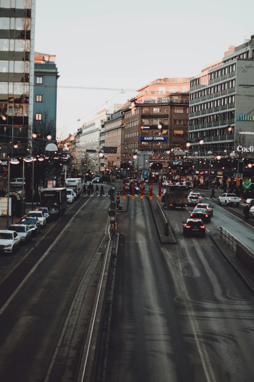 cars in traffic on a very wide highway in the city