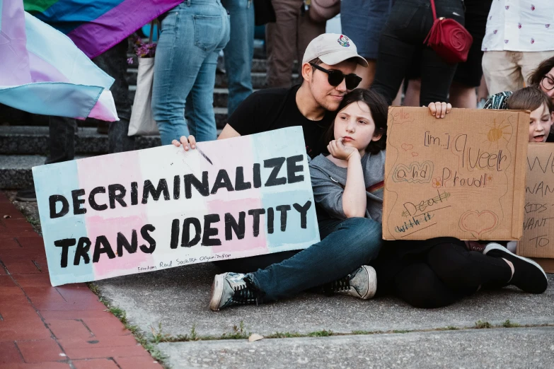 some people with signs on some steps