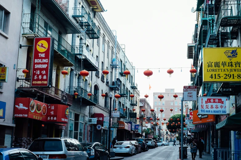 people walking along an asian - style city street