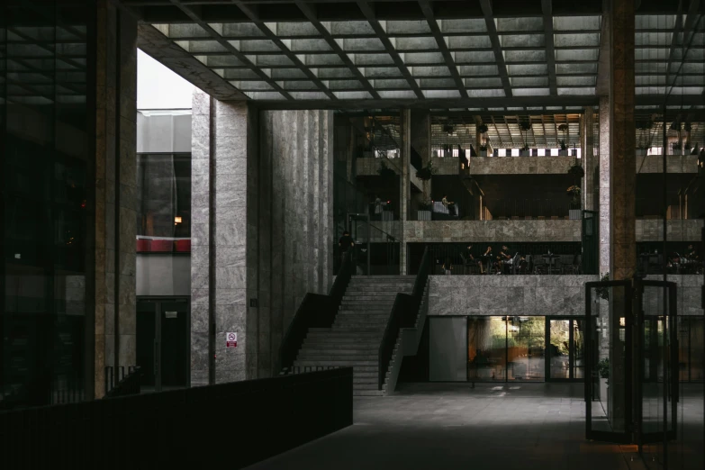 inside a building with some stairs and lights