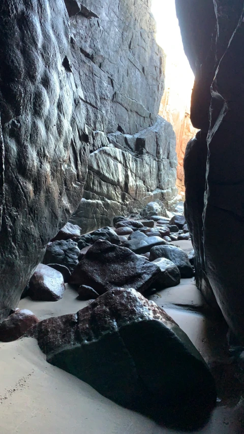 snow is falling on the rocks of a canyon