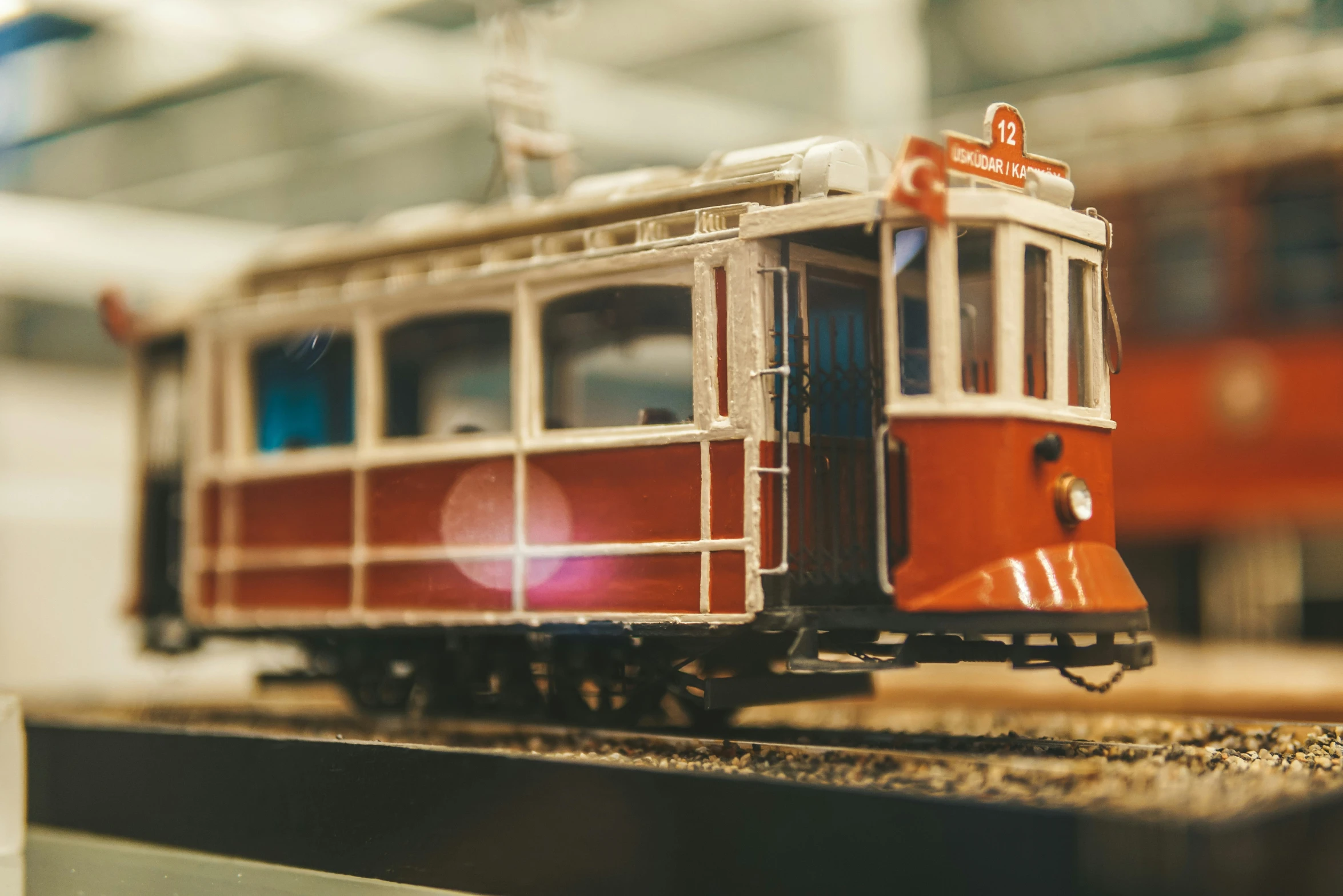 an old fashioned trolley car sitting on the tracks