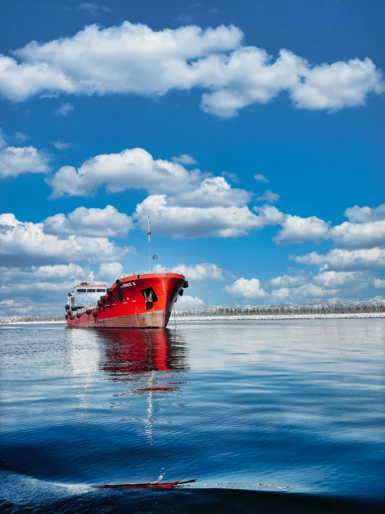 a boat is sitting out in the water