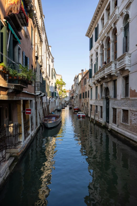 a long narrow canal runs between two buildings