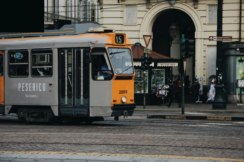 a trolley in the middle of an urban setting