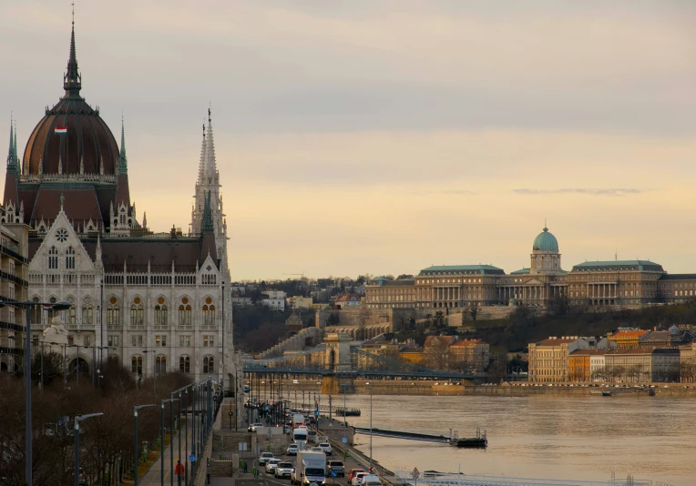 a city next to a large body of water with a castle