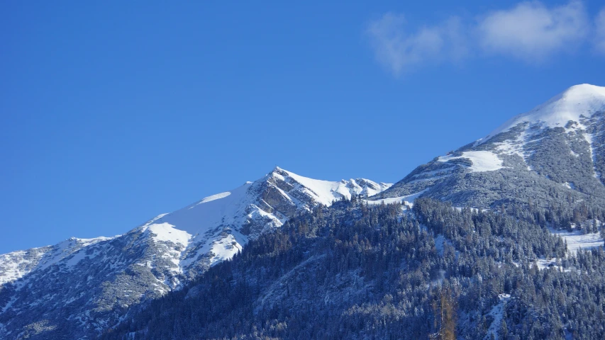 a po of the snow covered mountains, taken from a distance