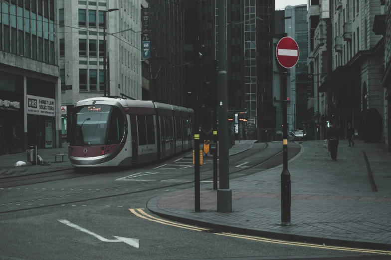 a street with a light rail running through it