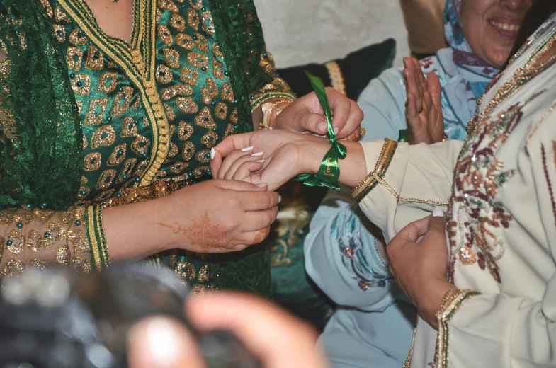 bride and groom are exchanging their wedding rings