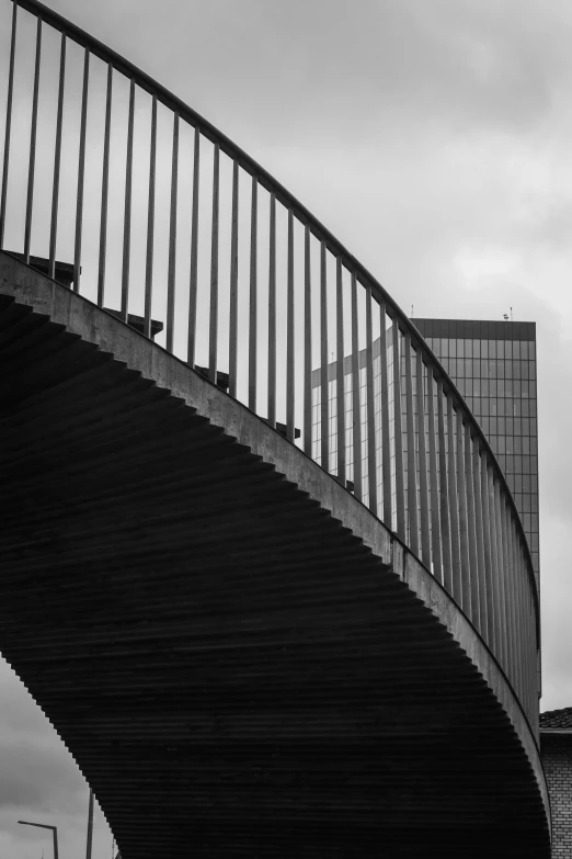 an outside view of a bridge that has a bench on the bottom