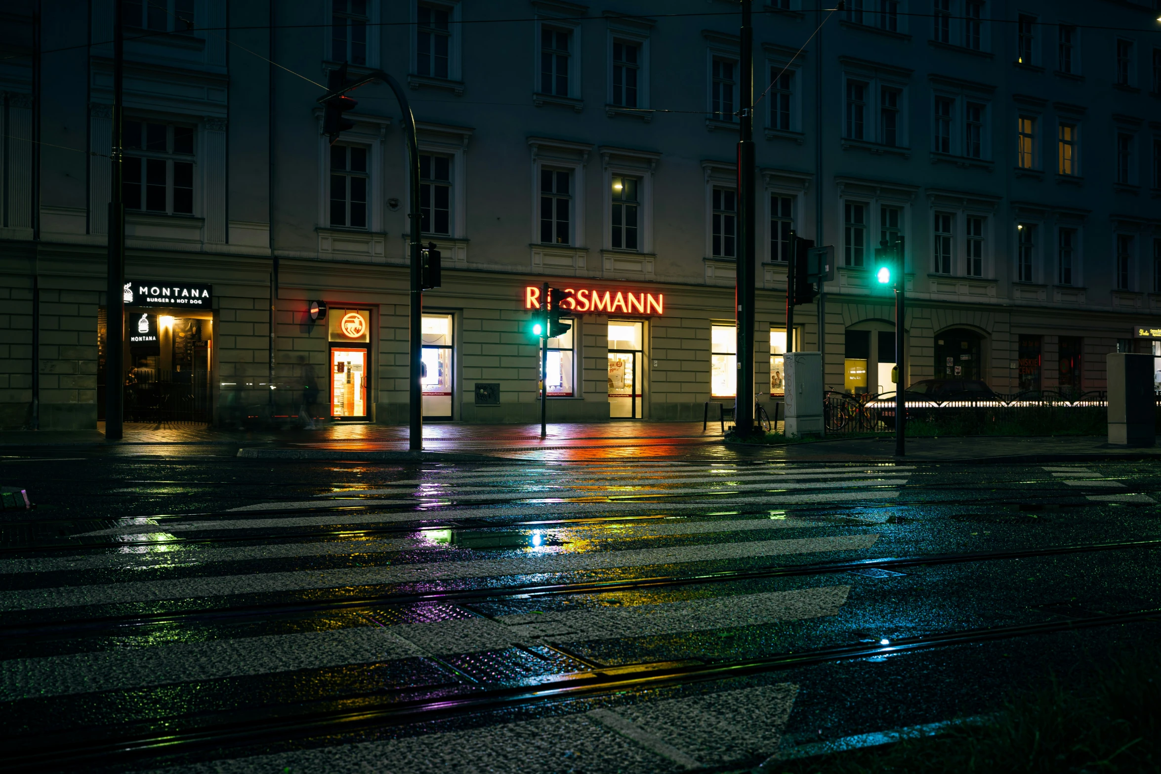 a street with lights on in the middle of the night