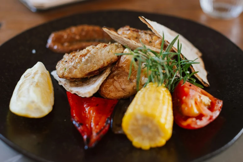 a plate topped with fried meat and vegetables