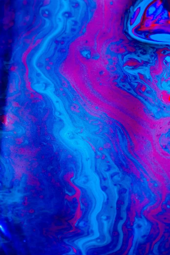 fluid abstract painting in purple and blue