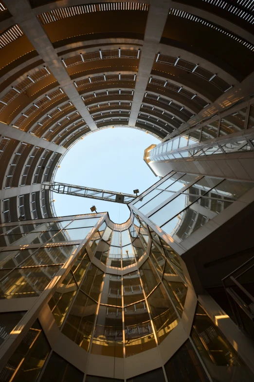 a building looking up at a sky line and circular building