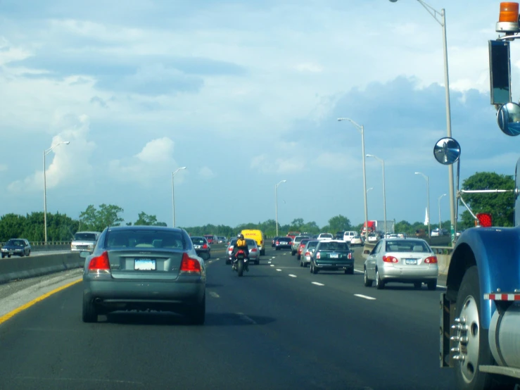 a busy highway with many cars passing each other