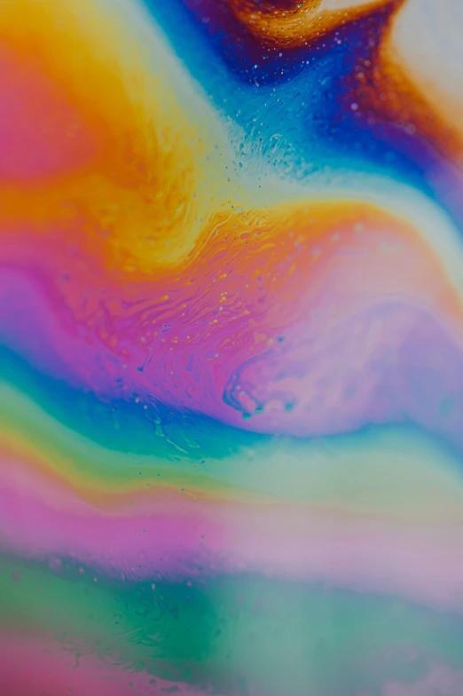 a colorful fluid painting on a table