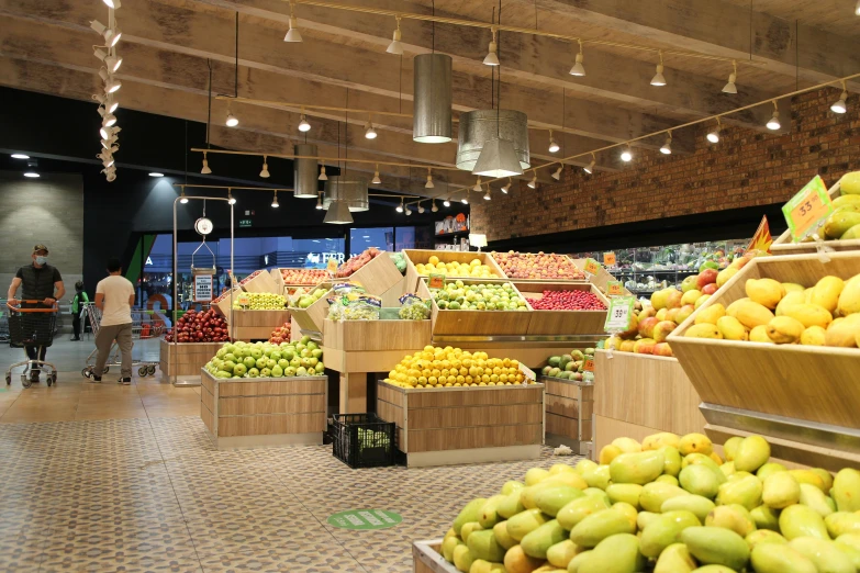 a grocery store with lots of fresh fruit in the middle