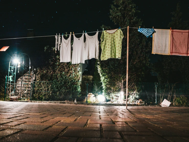 laundry hangs on clothes lines on the street