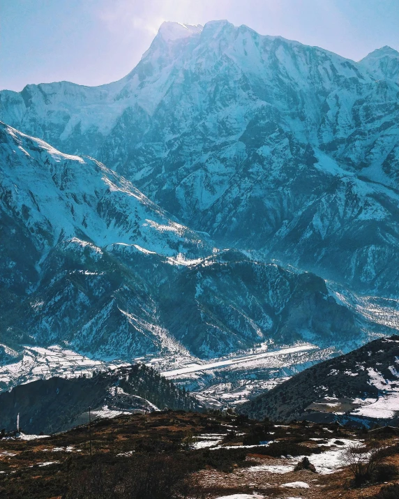 a view from the top of a mountain with some snow