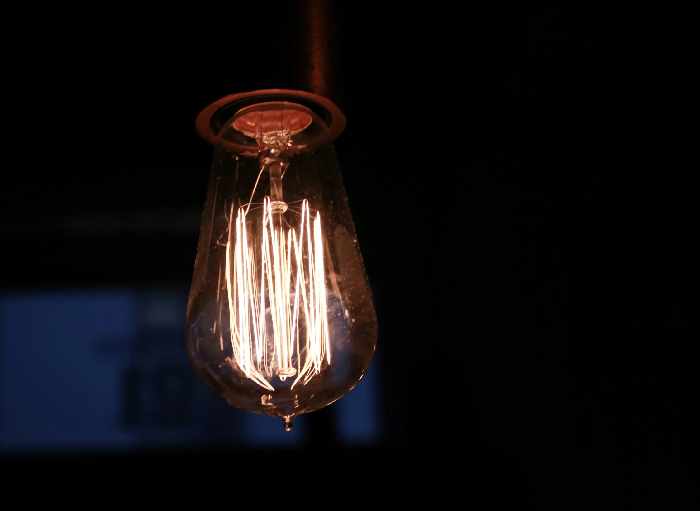 the light is being hung from a ceiling fixture