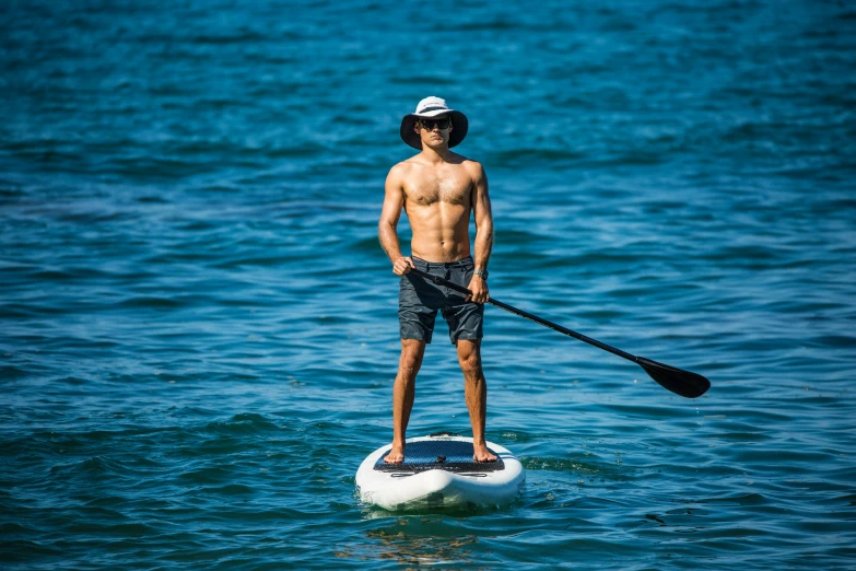 a person on a paddle board in the water