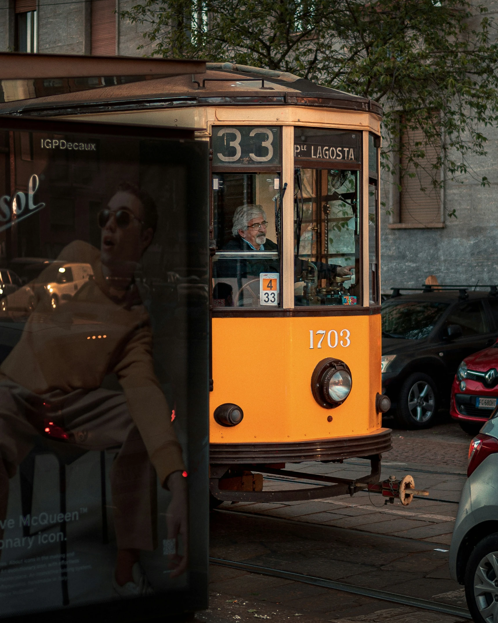 a street car with a reflection of a baby on the side of it