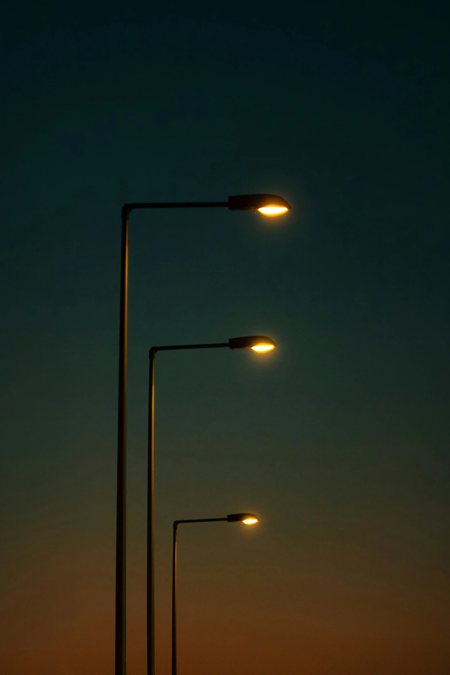 street light and traffic light on the road