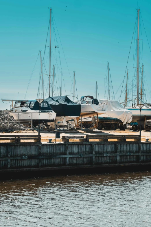 some boats in the water by a dock