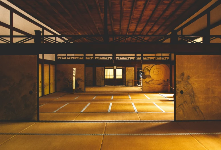 an empty room with wood walls and some doors