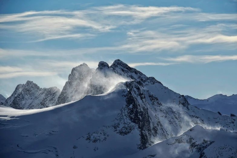 the top of a mountain with some very steep mountains