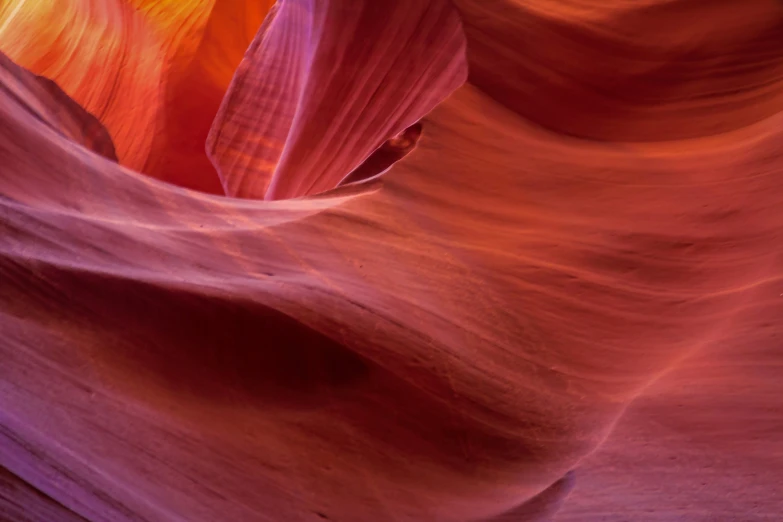 a person walks up and down a slot in the desert