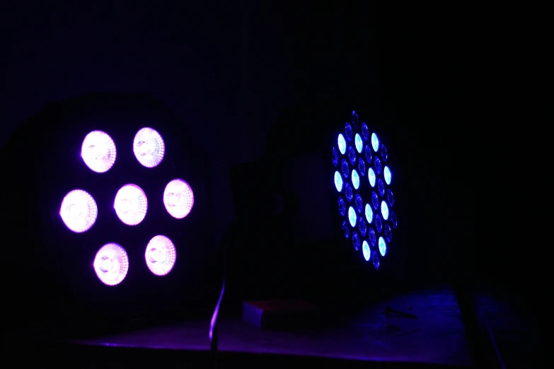 two lights with a purple and blue background