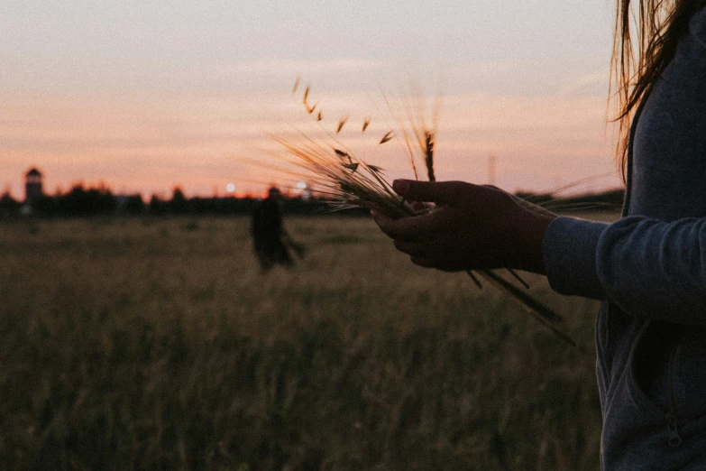 a person in a field with some grass