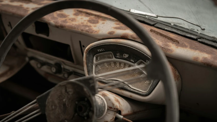 an old car dashboard with rusted parts on it