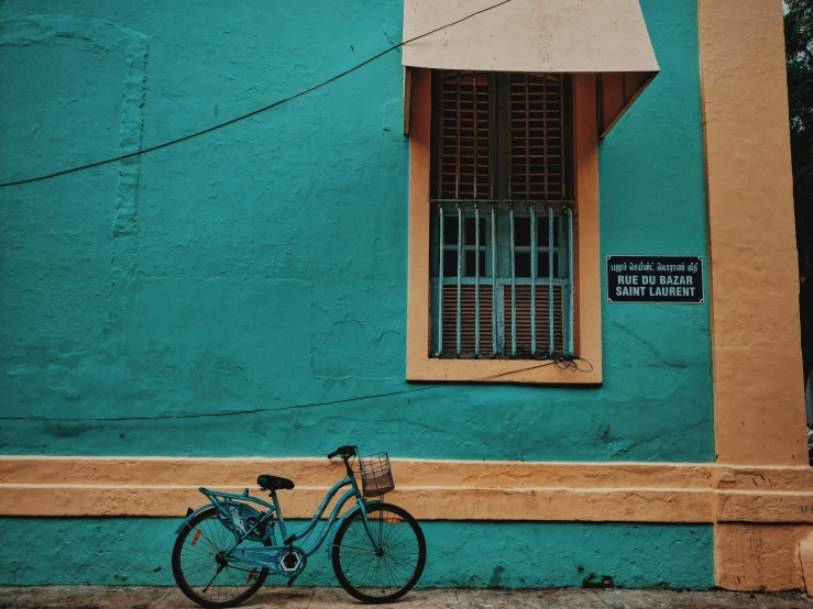 there is a bicycle next to the front of this building