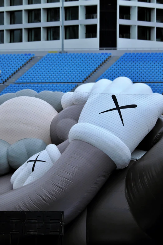 a giant inflatable dog with a cross on its head