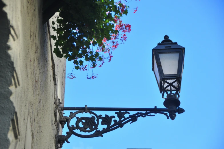 a street lamp hangs off a building