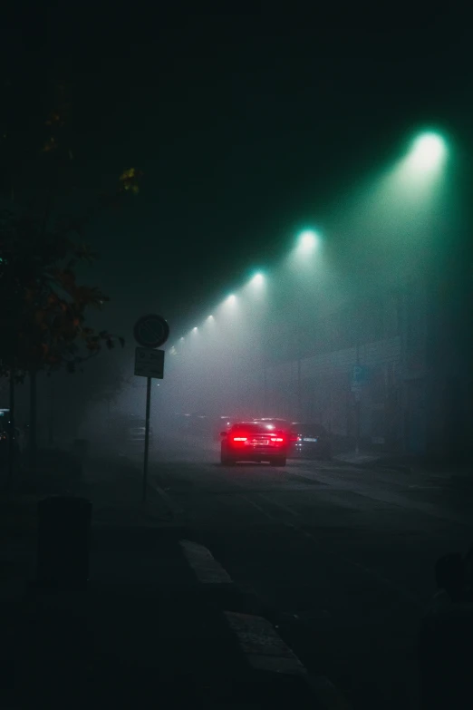the cars in the fog are red as well