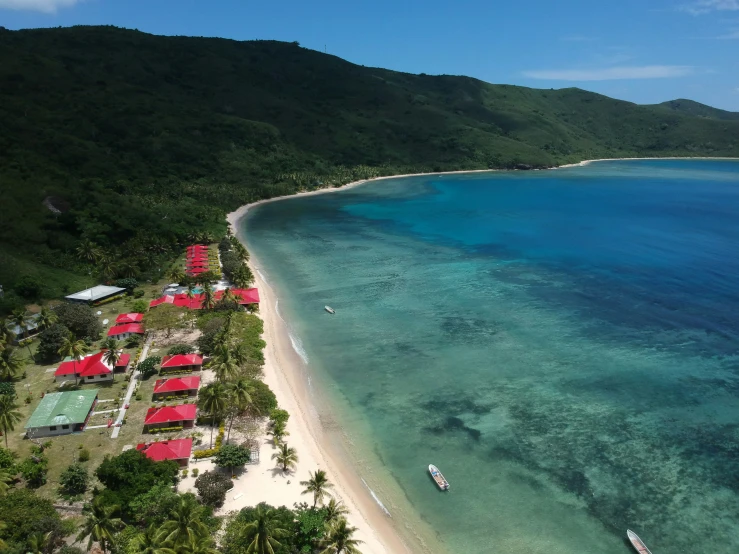 an aerial view of an empty beach and coral