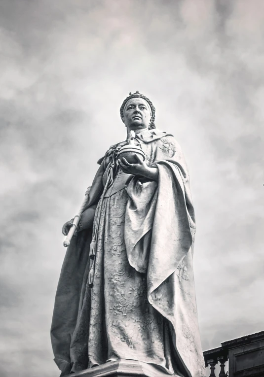 the statue is overlooking the cloudy sky