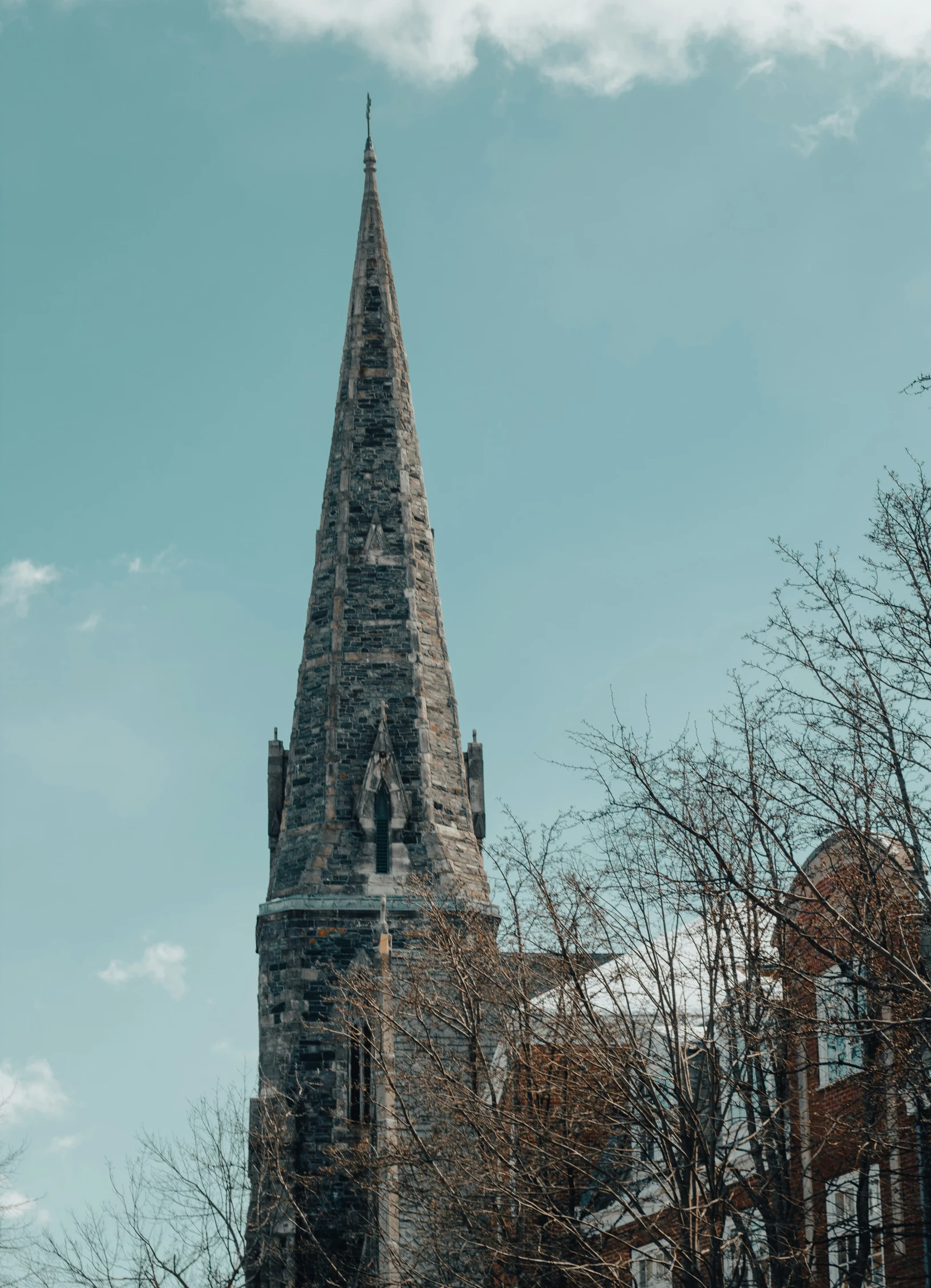 an old church with a clock tower and many windows