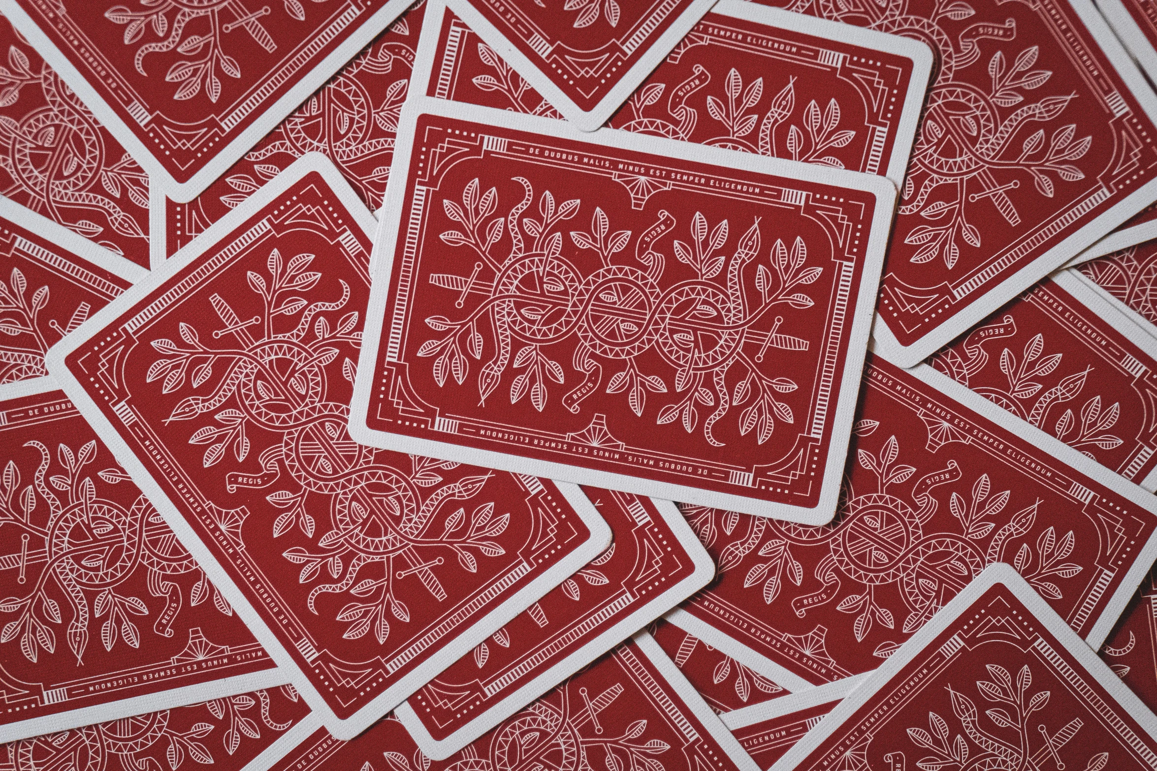 red bandana cloth, which has white border and an intricate design