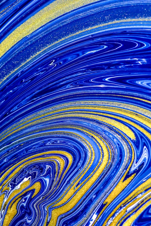 an abstract image of blue and yellow swirled
