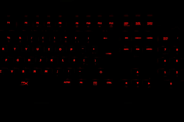 the backlit of a red glowing computer keyboard