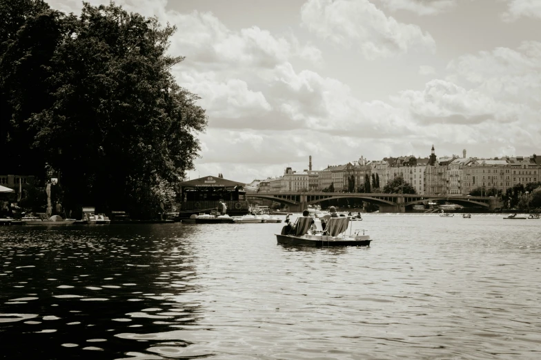 two people riding on a boat in the water