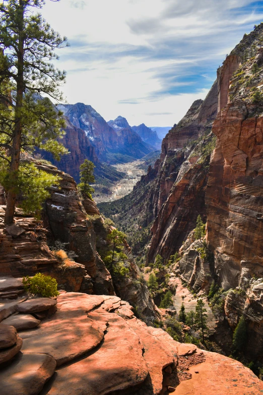 a trail winds through the side of the mountains