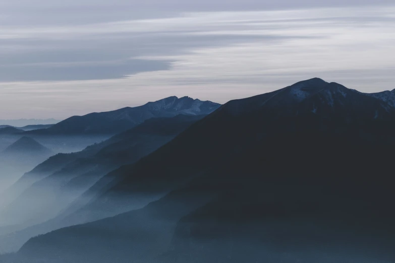 a hazy mountainside, with a lot of snow