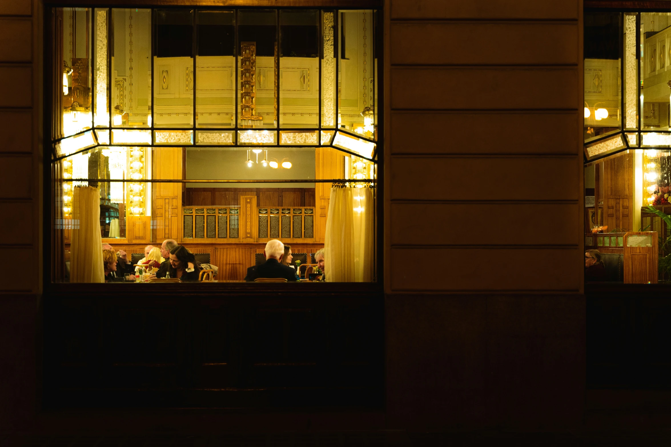 people outside at a bar in a dark area